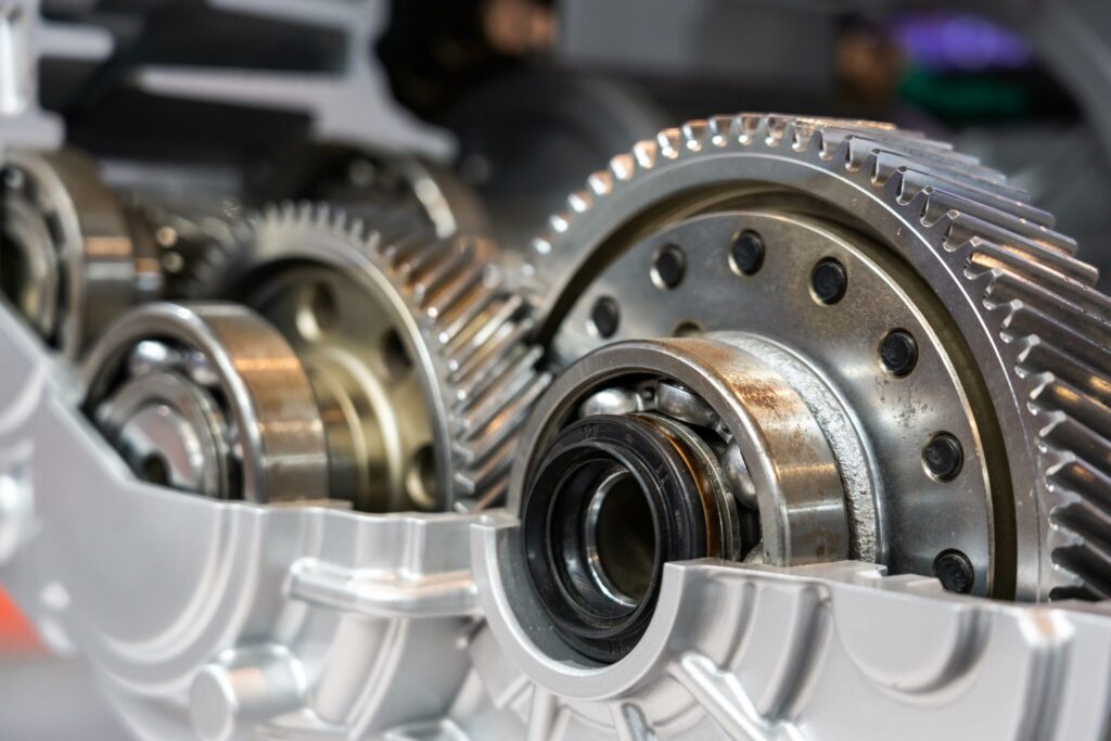 Close-up of precision GRW ball bearings and gears assembled inside a high-performance mechanical housing.