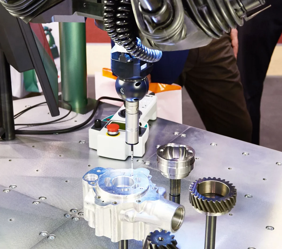 Close-up of a precision engineering process involving advanced machinery working on industrial components, highlighting the intricacy and accuracy required in manufacturing.
